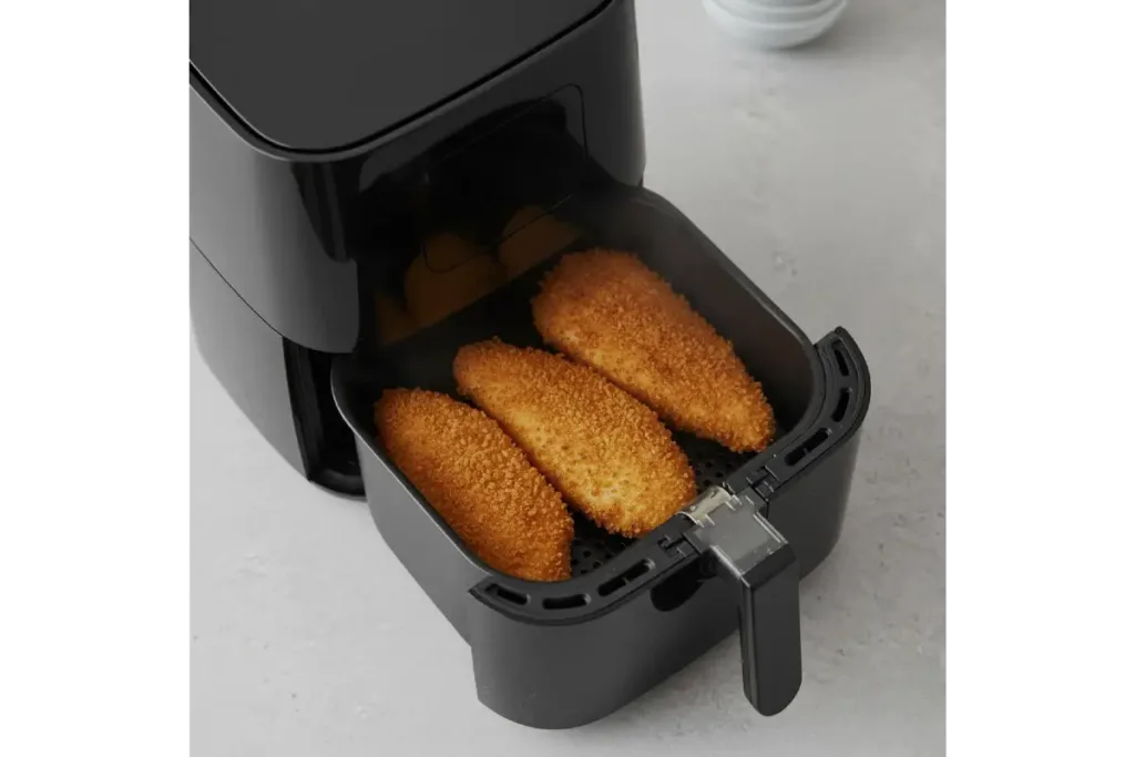 Air Fryer Chicken Breast That Stays Juicy Air Fryer Chicken Breast Golden breaded chicken breasts cooked in an open air fryer basket